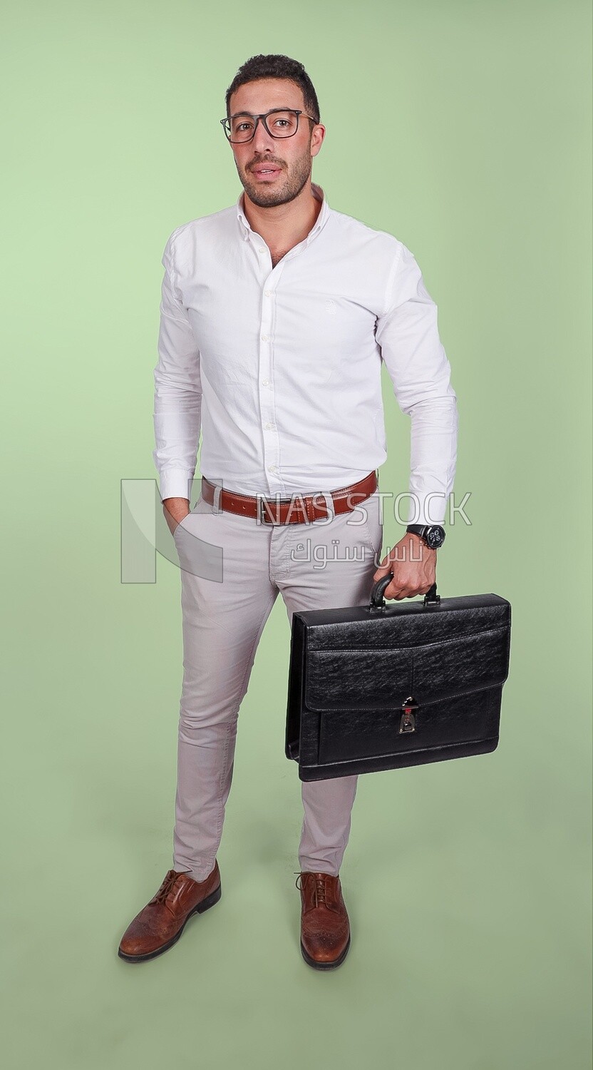 Photo of a handsome man wearing glasses and holding a leather bag, business and partnership development, business meeting, model