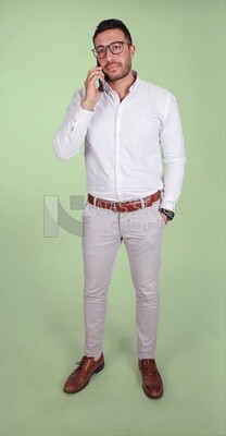 Photo of a handsome man wearing glasses standing and talking on the phone, business development and partnerships, business meeting, model