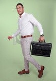 Photo of a handsome man wearing glasses and holding a leather bag, business and partnership development, business meeting, model