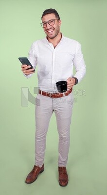 Photo of a handsome man wearing glasses standing looking at his phone and drinking coffee, business development and partnerships, business meeting, model