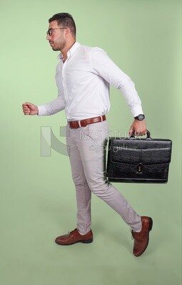 Photo of a handsome man wearing glasses and holding a leather bag, business and partnership development, business meeting, model