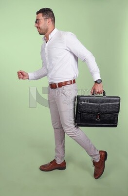 Photo of a handsome man wearing glasses and holding a leather bag, business and partnership development, business meeting, model