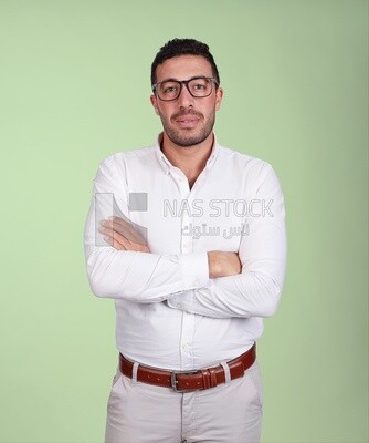 Portrait of a handsome man standing with glasses wearing formal wear with crossed hands, business development and partnerships, business meeting, Model