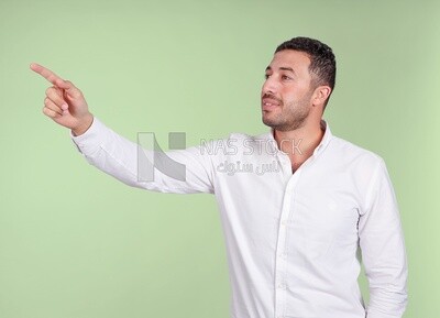 Portrait of a man wearing formal wear pointing away, business development and partnerships, business meeting, Model