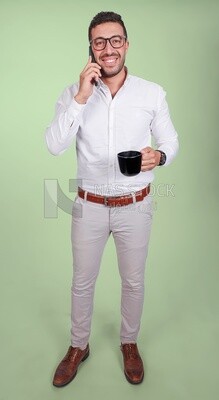 Photo of a handsome man wearing glasses standing talking on his phone and drinking coffee, business development and partnerships, business meeting, model
