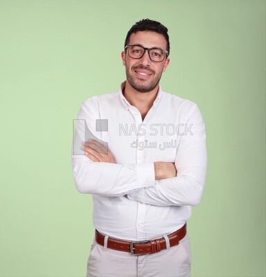 Portrait of a handsome man standing with glasses wearing formal wear with crossed hands, business development and partnerships, business meeting, Model