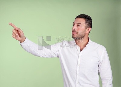 Portrait of a man wearing formal wear pointing away, business development and partnerships, business meeting, Model