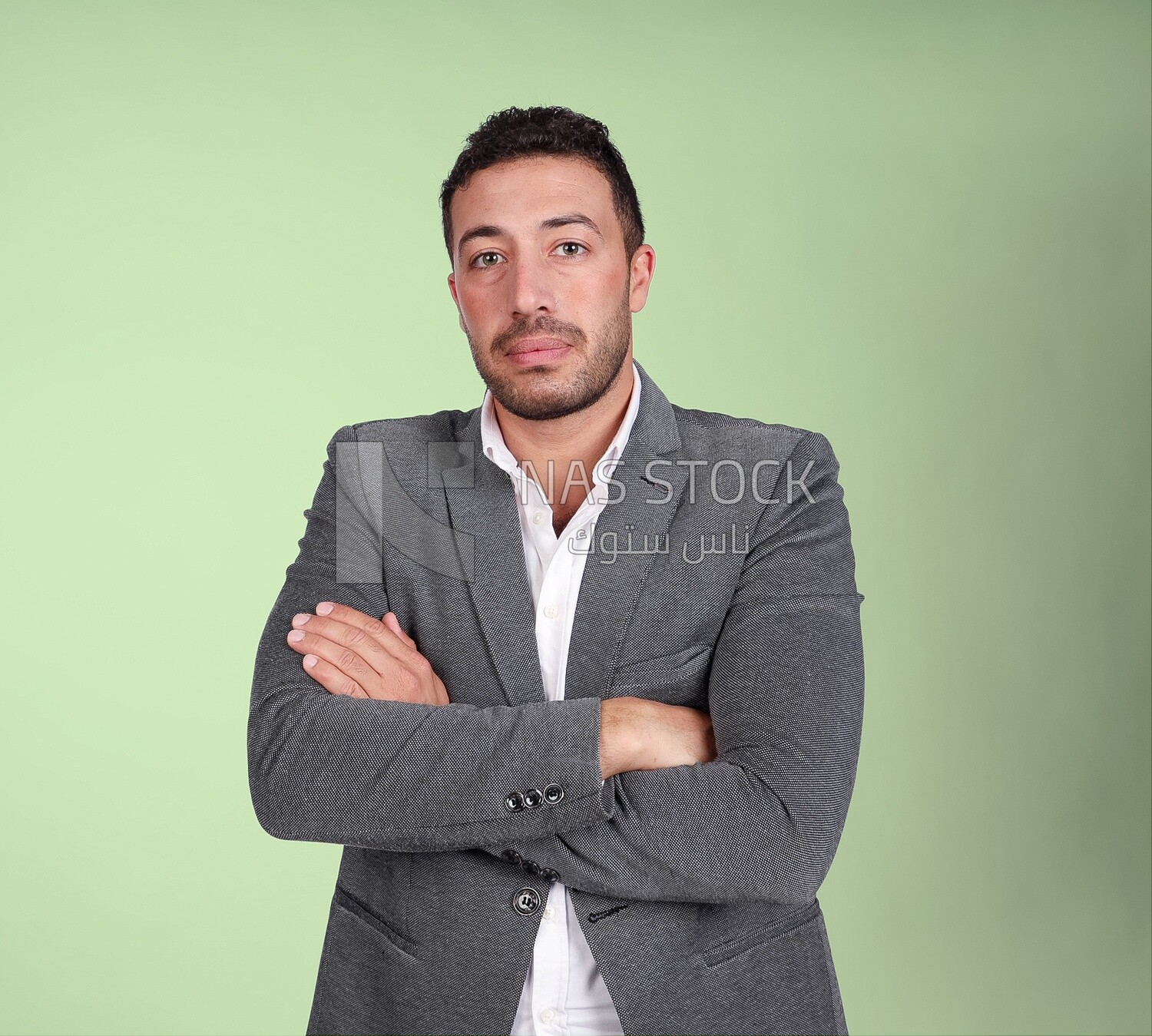 Portrait of a handsome man standing wearing formal wear with crossed hands, business development and partnerships, business meeting, Model