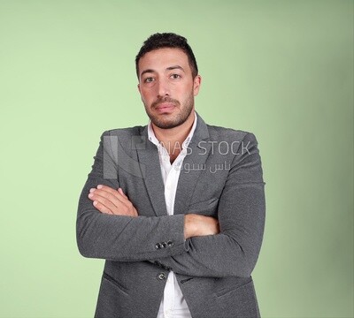 Portrait of a handsome man standing wearing formal wear with crossed hands, business development and partnerships, business meeting, Model