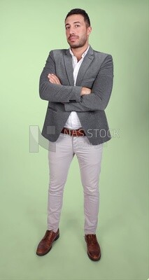 Portrait of a handsome man standing wearing formal wear with crossed hands, business development and partnerships, business meeting, Model