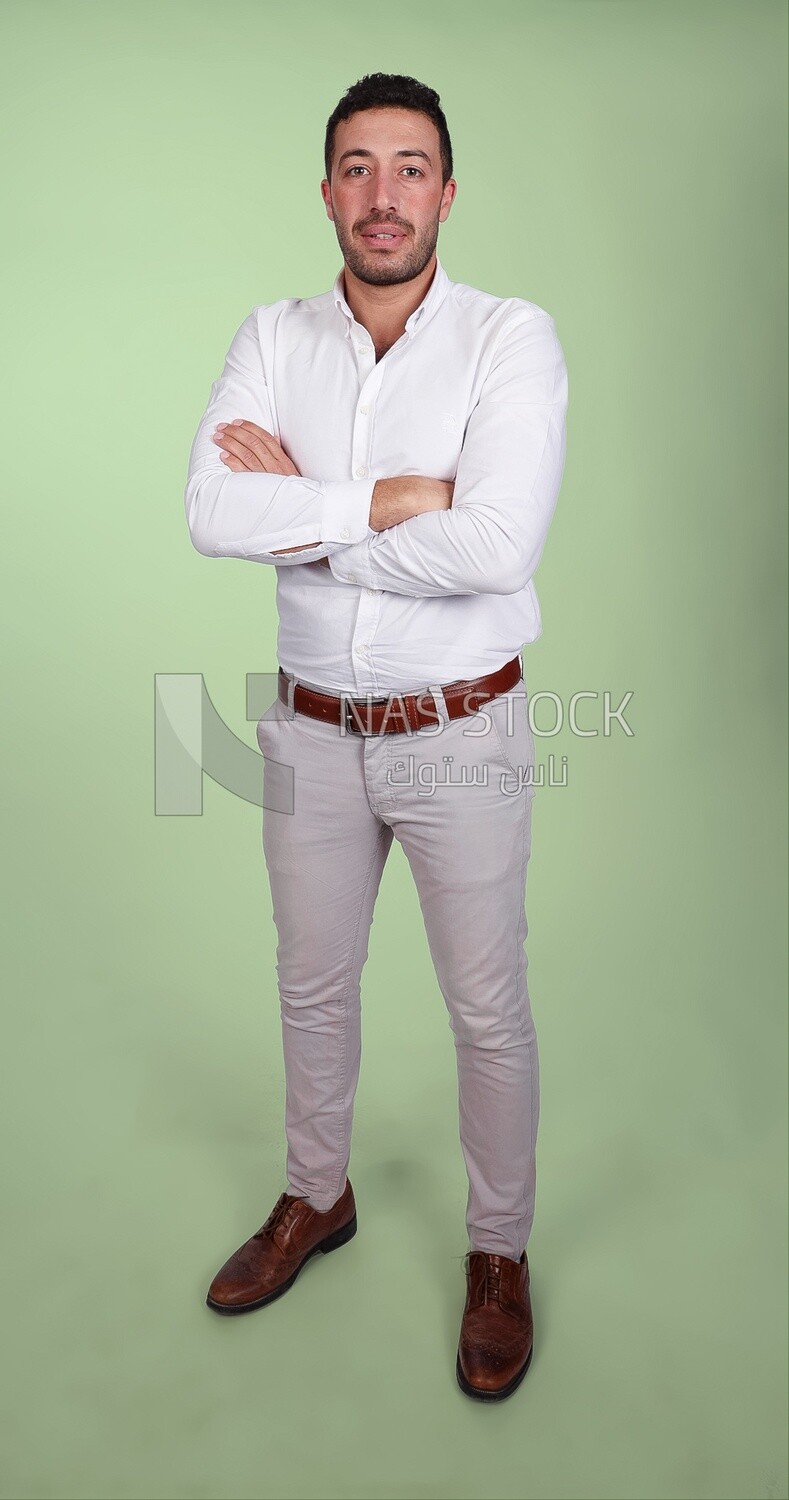 Portrait of a handsome man standing wearing formal wear with crossed hands, business development and partnerships, business meeting, Model
