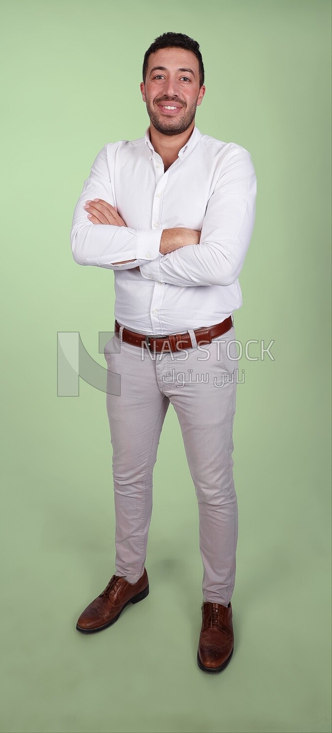 Portrait of a handsome man standing wearing formal wear with crossed hands, business development and partnerships, business meeting, Model