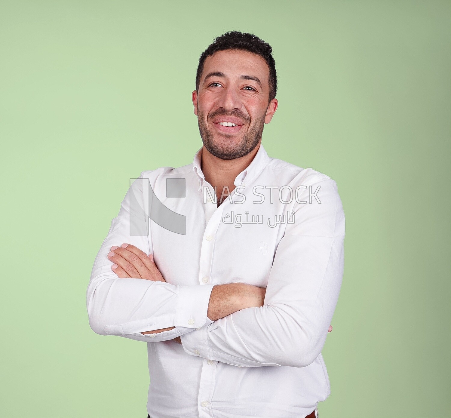 Portrait of a handsome man standing wearing formal wear with crossed hands, business development and partnerships, business meeting, Model