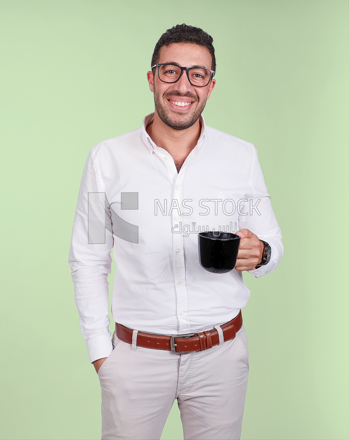 Photo of a handsome man wearing glasses and standing holding a cup of coffee, business development and partnerships, business meeting, model