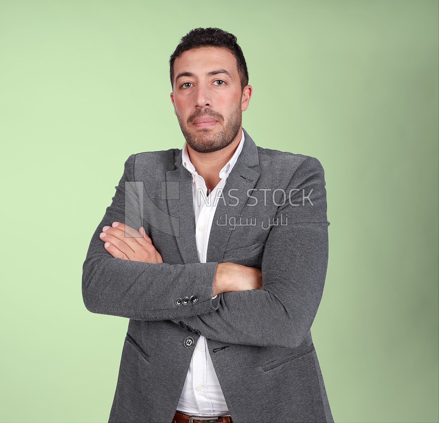 Portrait of a handsome man standing wearing formal wear with crossed hands, business development and partnerships, business meeting, Model