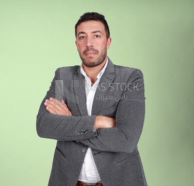 Portrait of a handsome man standing wearing formal wear with crossed hands, business development and partnerships, business meeting, Model