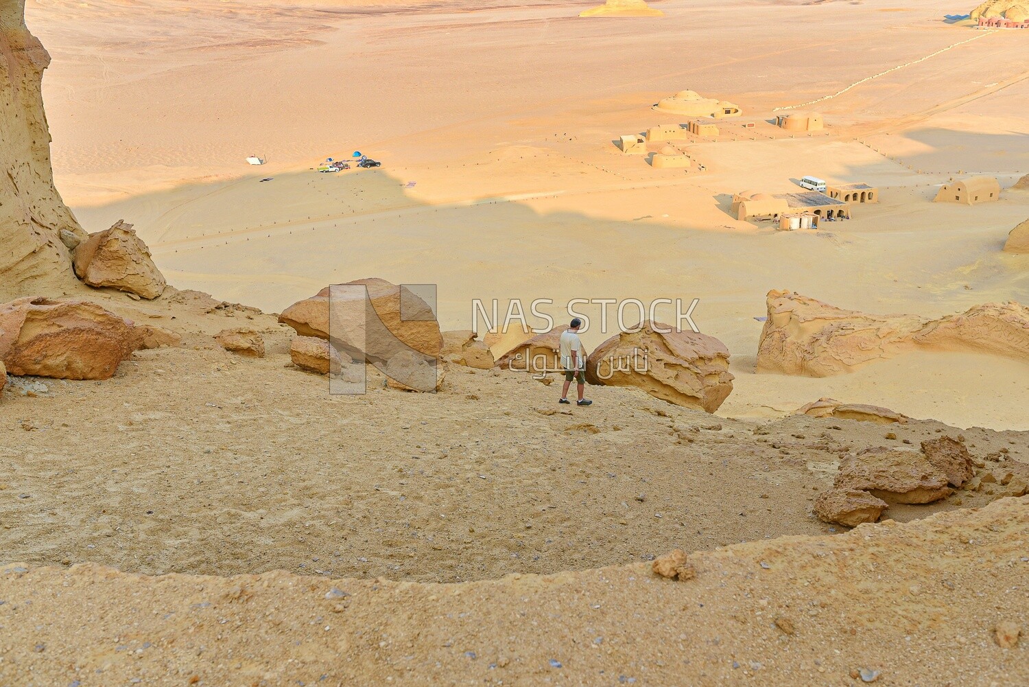 A scene of a man descending from one of the mountains of Wadi El Hitan in Egypt