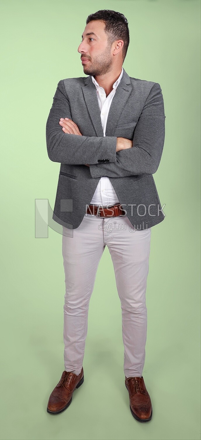 Portrait of a handsome man standing wearing formal wear with crossed hands, business development and partnerships, business meeting, Model