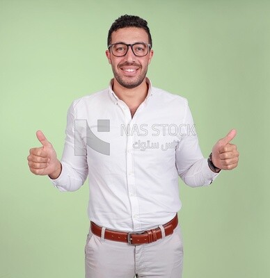 Photo of a handsome man with glasses standing with thumb up hands, business development and partnerships, business meeting, Model