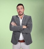 Portrait of a handsome man standing wearing formal wear with crossed hands, business development and partnerships, business meeting, Model