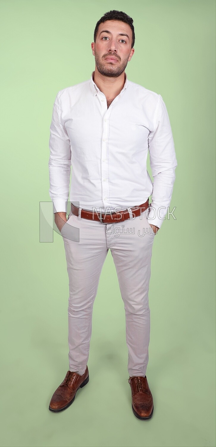 Portrait of a handsome man standing wearing formal wear with crossed hands, business development and partnerships, business meeting, Model