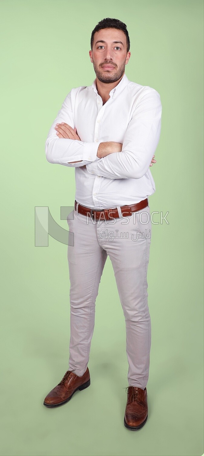 Portrait of a handsome man standing wearing formal wear with crossed hands, business development and partnerships, business meeting, Model