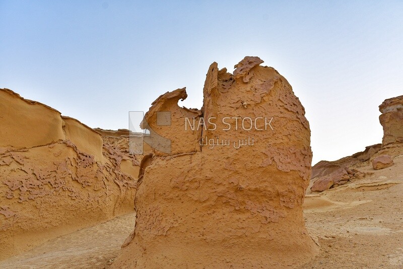 Rock formations on a sandy mountain in the Wadi El Hitan desert in Egypt