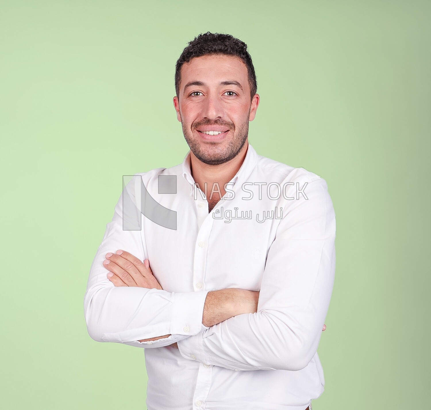 Portrait of a handsome man standing wearing formal wear with crossed hands, business development and partnerships, business meeting, Model