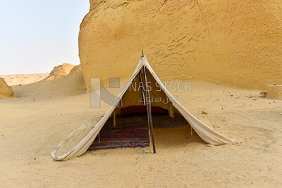 Scene of a Bedouin tent among the mountains in Wadi El Hitan, Egypt