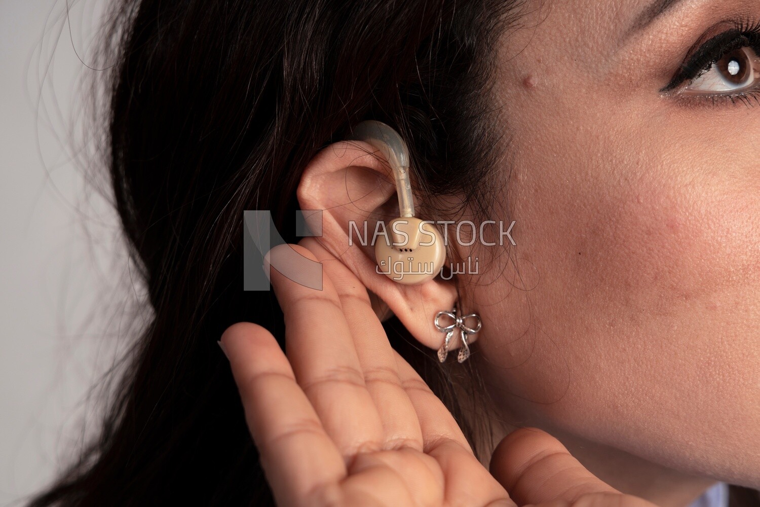 ear of a girl wearing a hearing aid