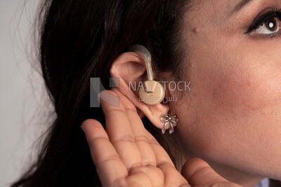 ear of a girl wearing a hearing aid