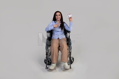 girl sitting in a wheelchair and pointing at an ID card,Services for people with disabilities