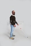 blind man wearing glasses and holding a stick