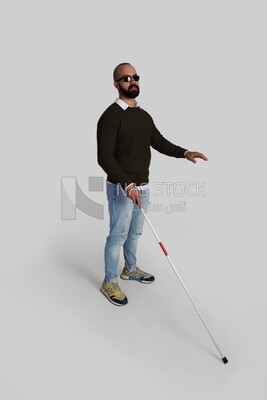 blind man wearing glasses and holding a walking stick