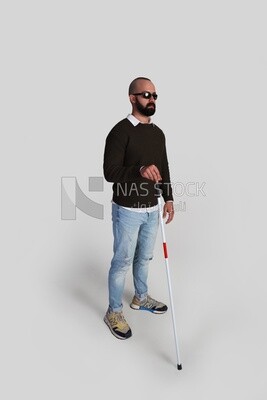blind man holding a walking stick and wearing glasses