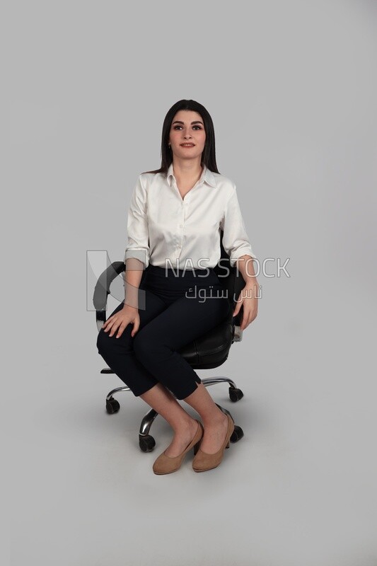 Photo of a businesswoman with formal wear sitting on the chair, business development and partnerships, business meeting, Model