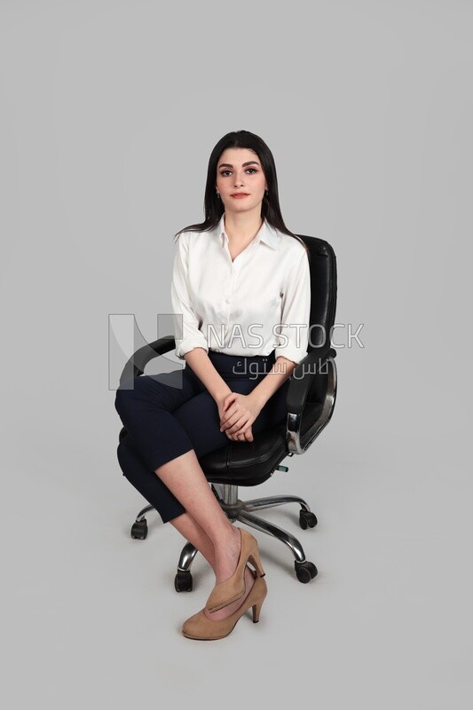 Photo of a businesswoman with formal wear sitting on a chair, business development and partnerships, business meeting, Model