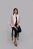 Photo of a businesswoman with formal wear sitting on the chair, business development and partnerships, business meeting, Model