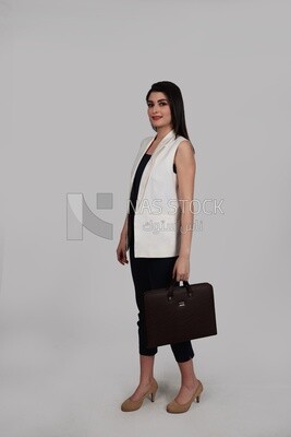 Photo of a businesswoman with formal wear holding a leather bag, business development and partnerships, business meeting, Model