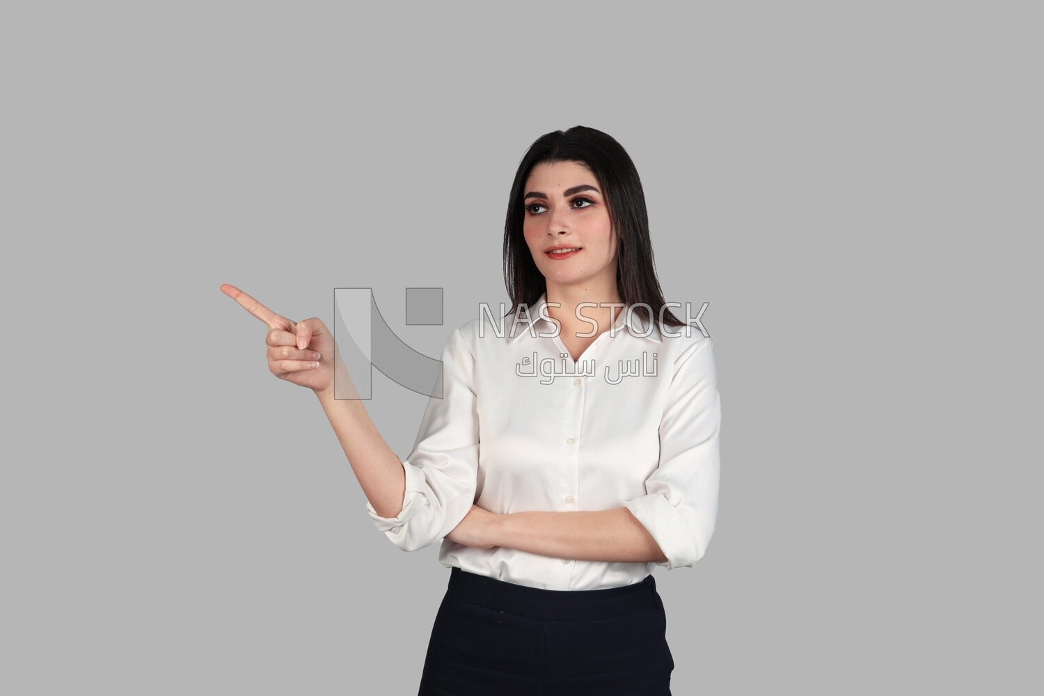 Photo of a businesswoman with formal wear pointing away, business development and partnerships, business meeting, Model