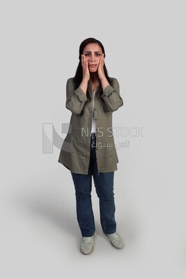 shocked woman placing her hand on her cheeks