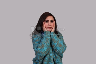 shocked woman placing her hand on her cheeks