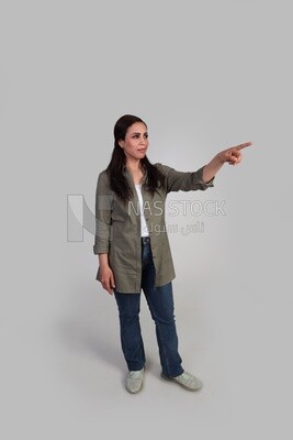 girl with long hair pointing to the right with her hand
