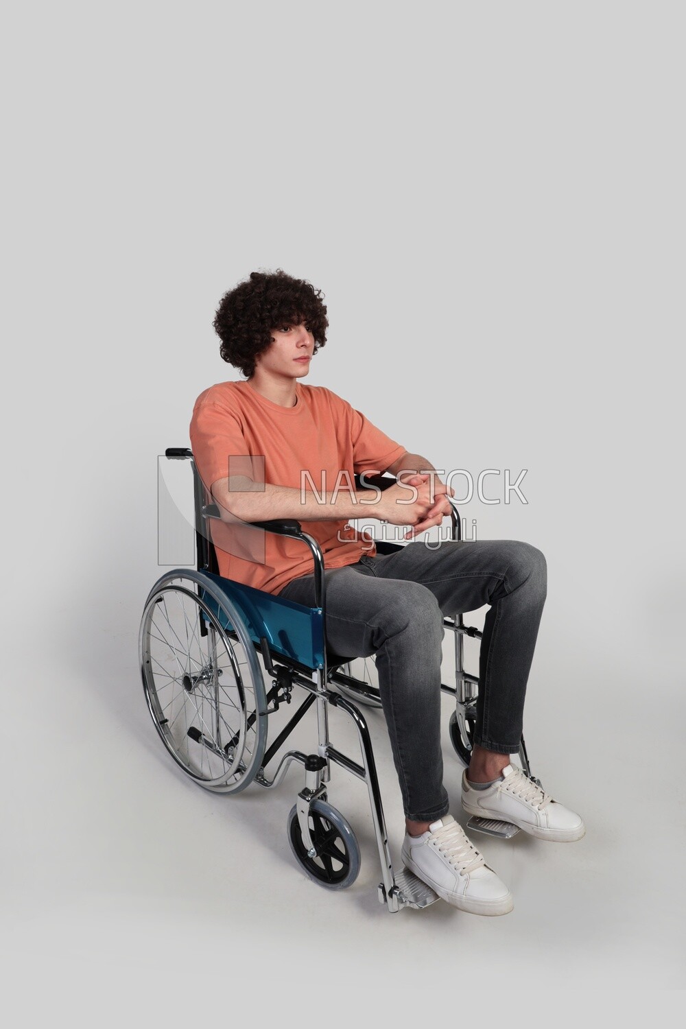 boy sitting in a wheelchair, patient, the concept of medicine and health care, an appointment to receive treatment in the hospital, emergency.