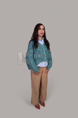beautiful girl with long brown hair standing politely