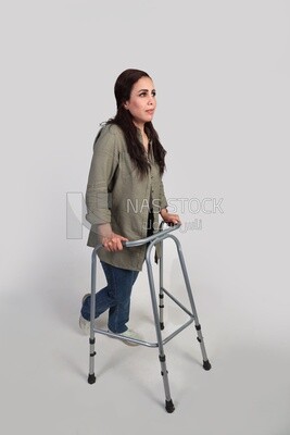 woman with an injured leg walking with crutches, patient, medicine and health care concept, medical professions and jobs.