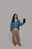 woman in classic clothes holding a phone