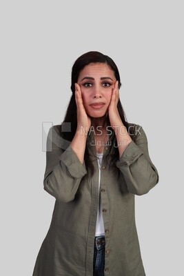 shocked woman placing her hand on her cheeks