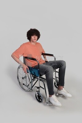 man sitting in a wheelchair, patient, the concept of medicine and health care, an appointment to receive treatment in the hospital, emergency.