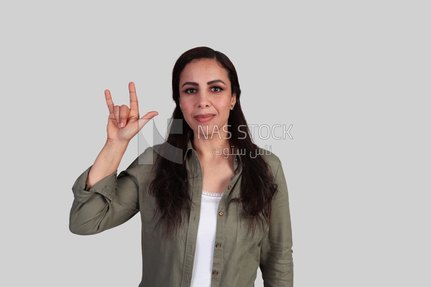 lady showing the gesture of love in sign language
